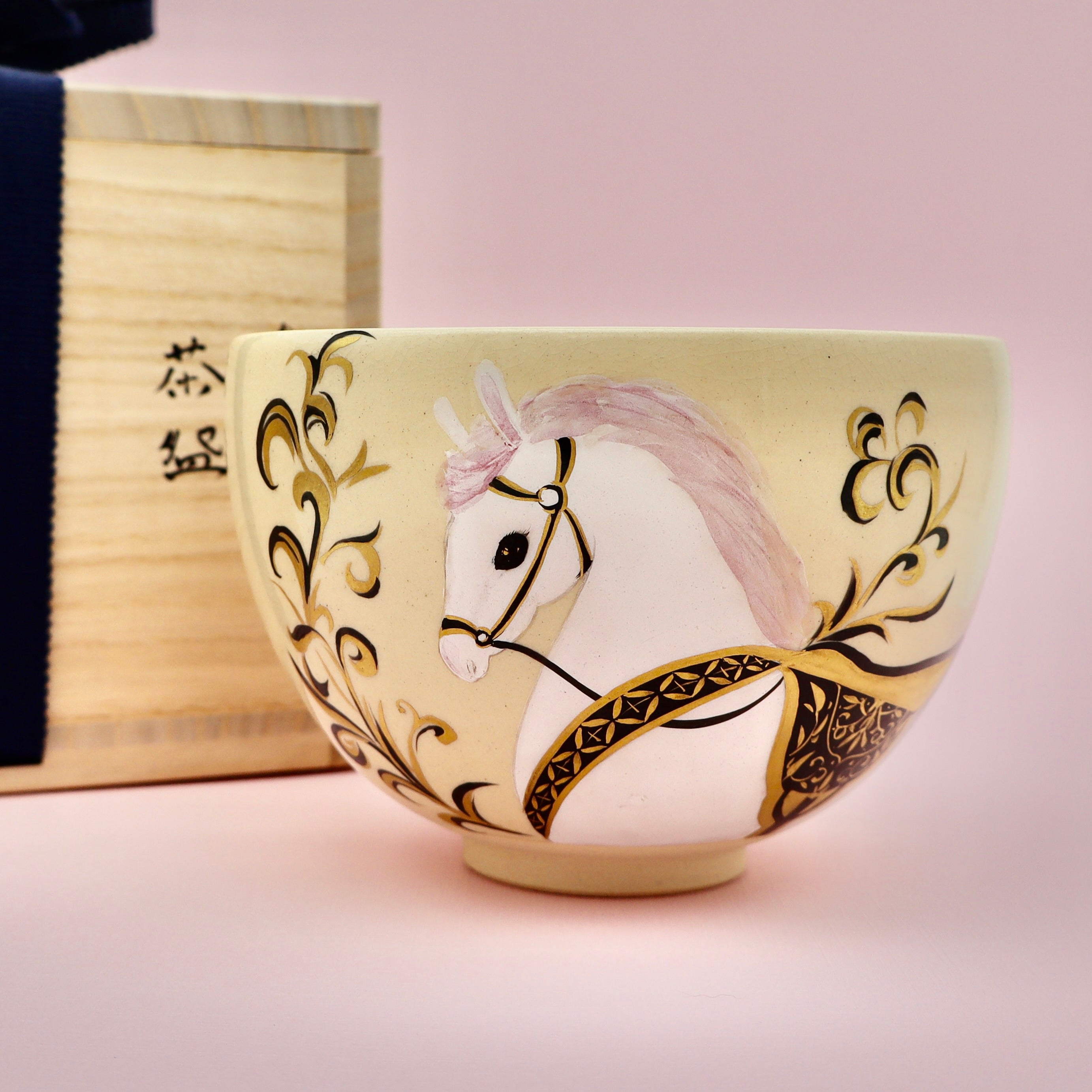 White pony Hakuba matcha chawan bowl - pink mane gold saddle, front view