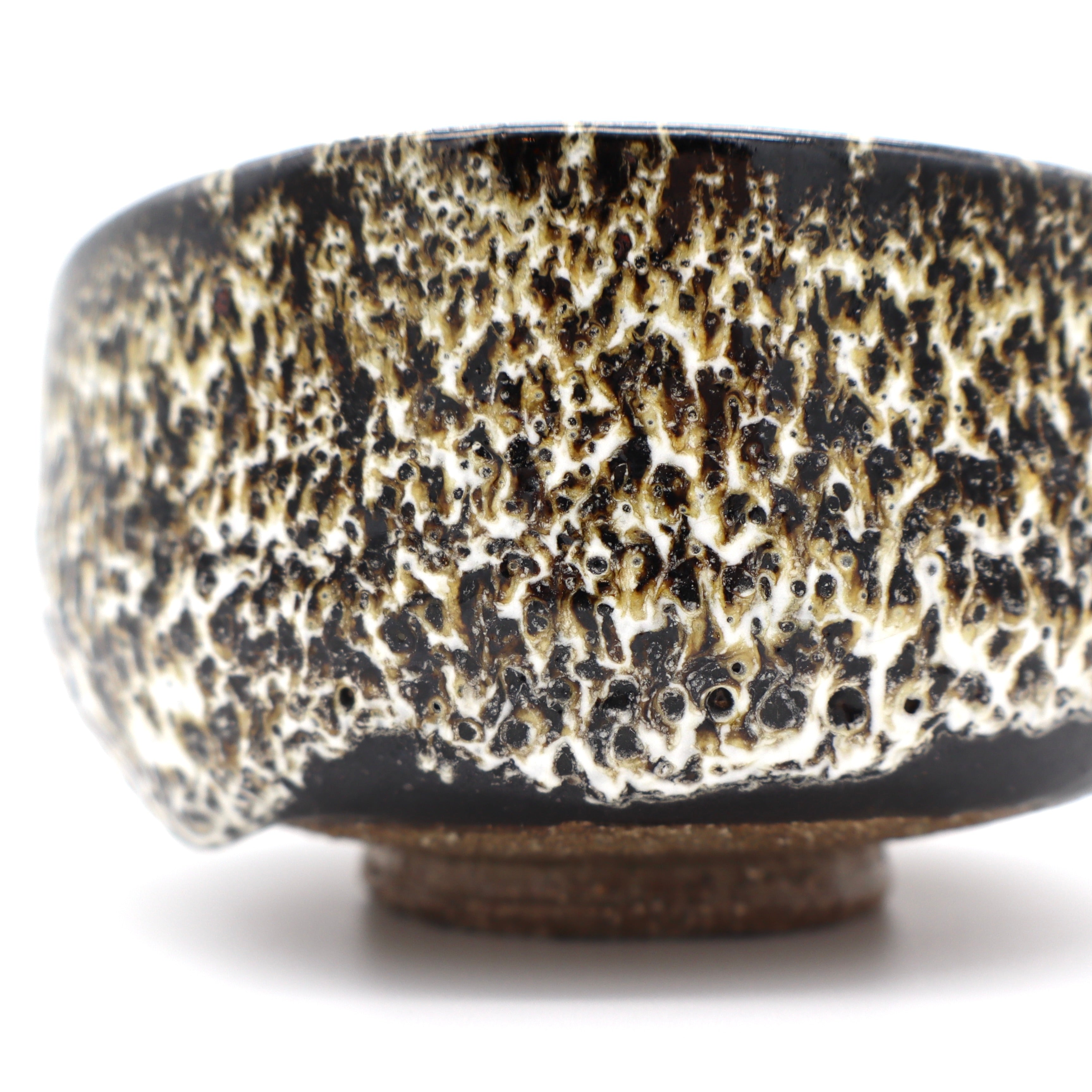Close up Aichi Japanese matcha chawan tea bowl side profile artisanal clay texture detail