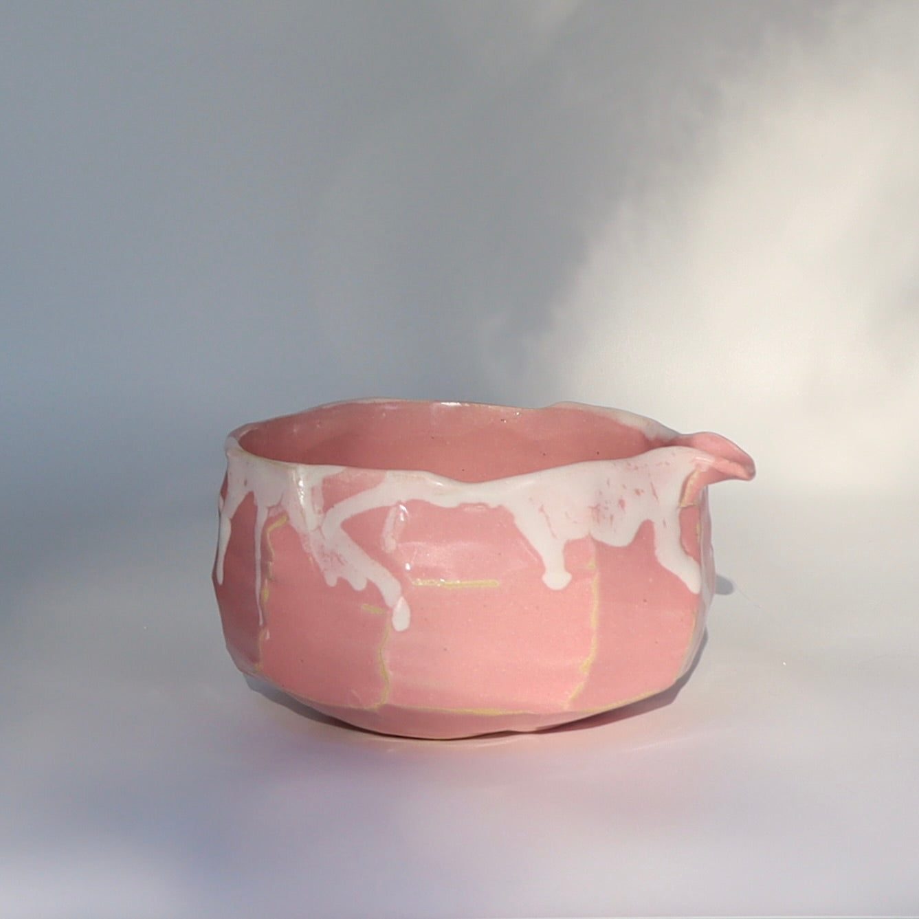 Pink kurinuki matcha chawan with spout - wabi sabi tea bowl side view, spout on right side