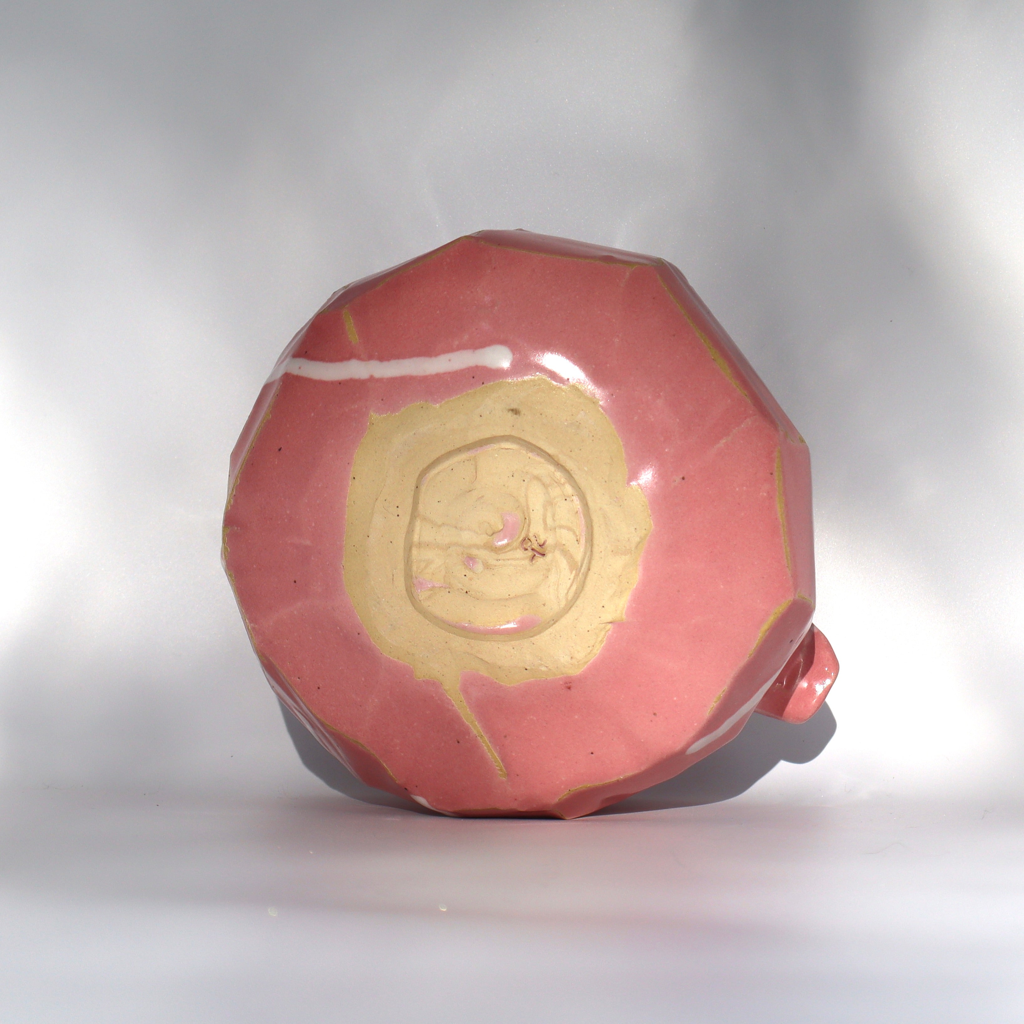 Artist signature on pink kurinuki katakuchi chawan